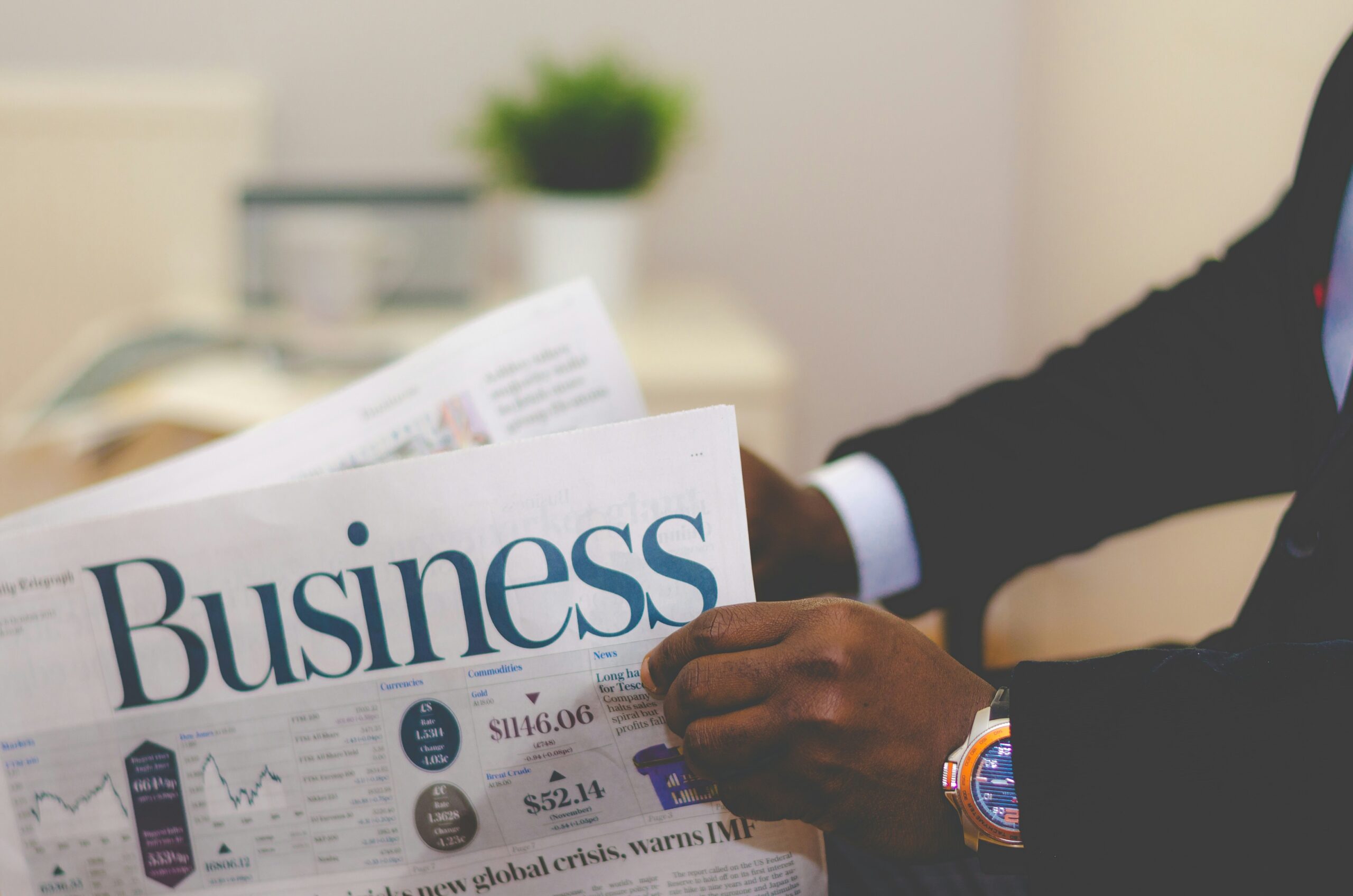 Business newspaper with financial charts, representing OrvexaTech.io's business results and case studies